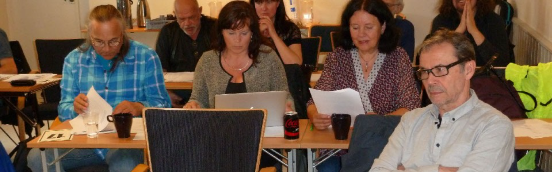 Image of people sitting in a meeting