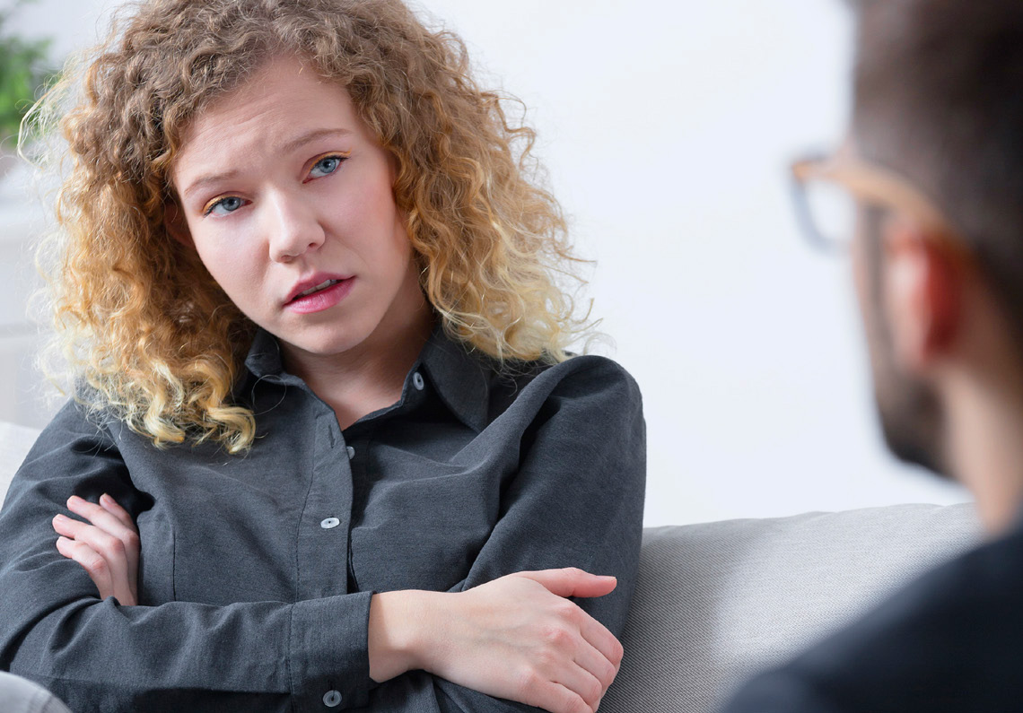 Image of a woman talking to a man